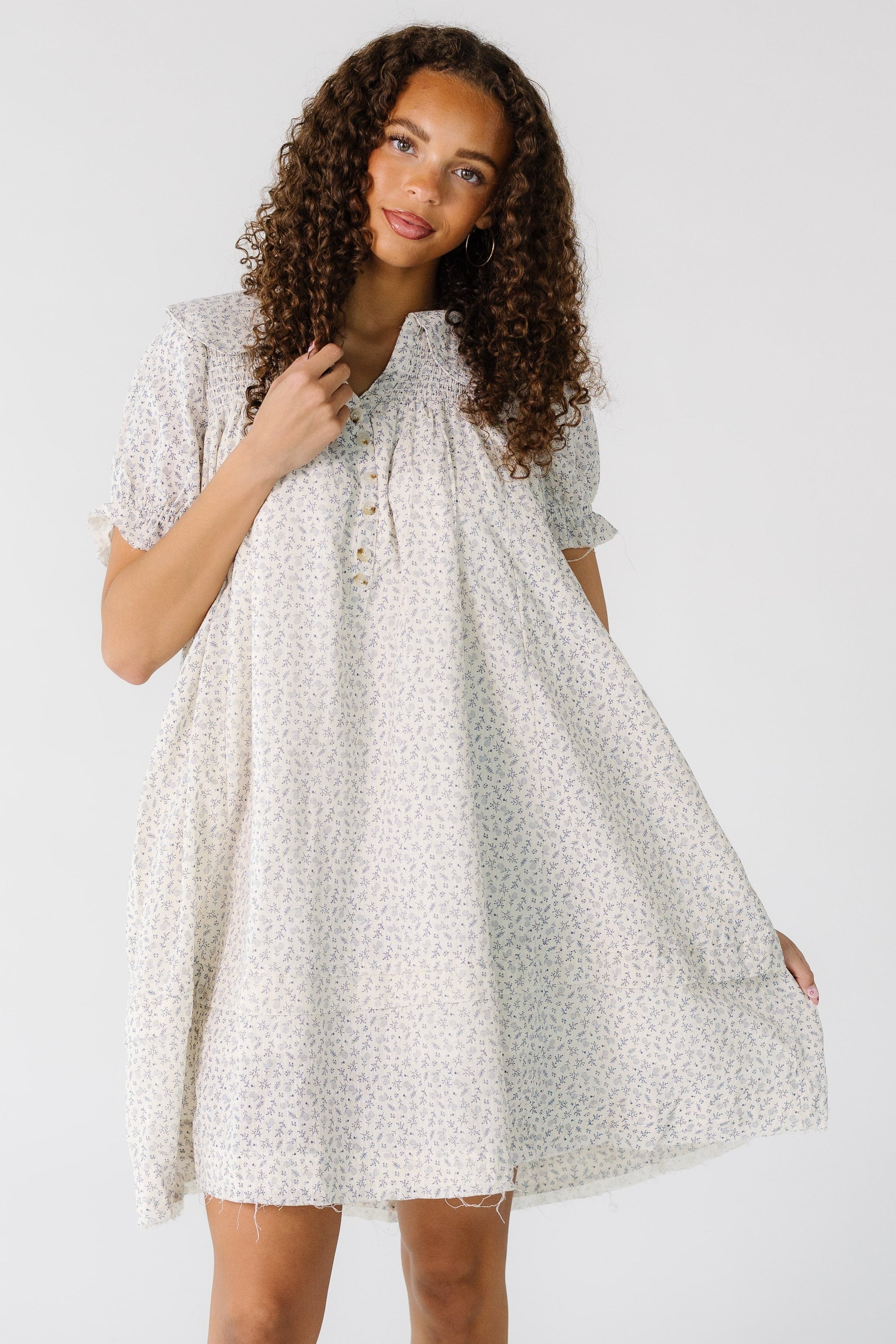 Teengirlwearingashortfloralprintdressingreywithshortsleevesandscissorcuthems.jpg Brass & Roe Ditsy Collared Knee Dress