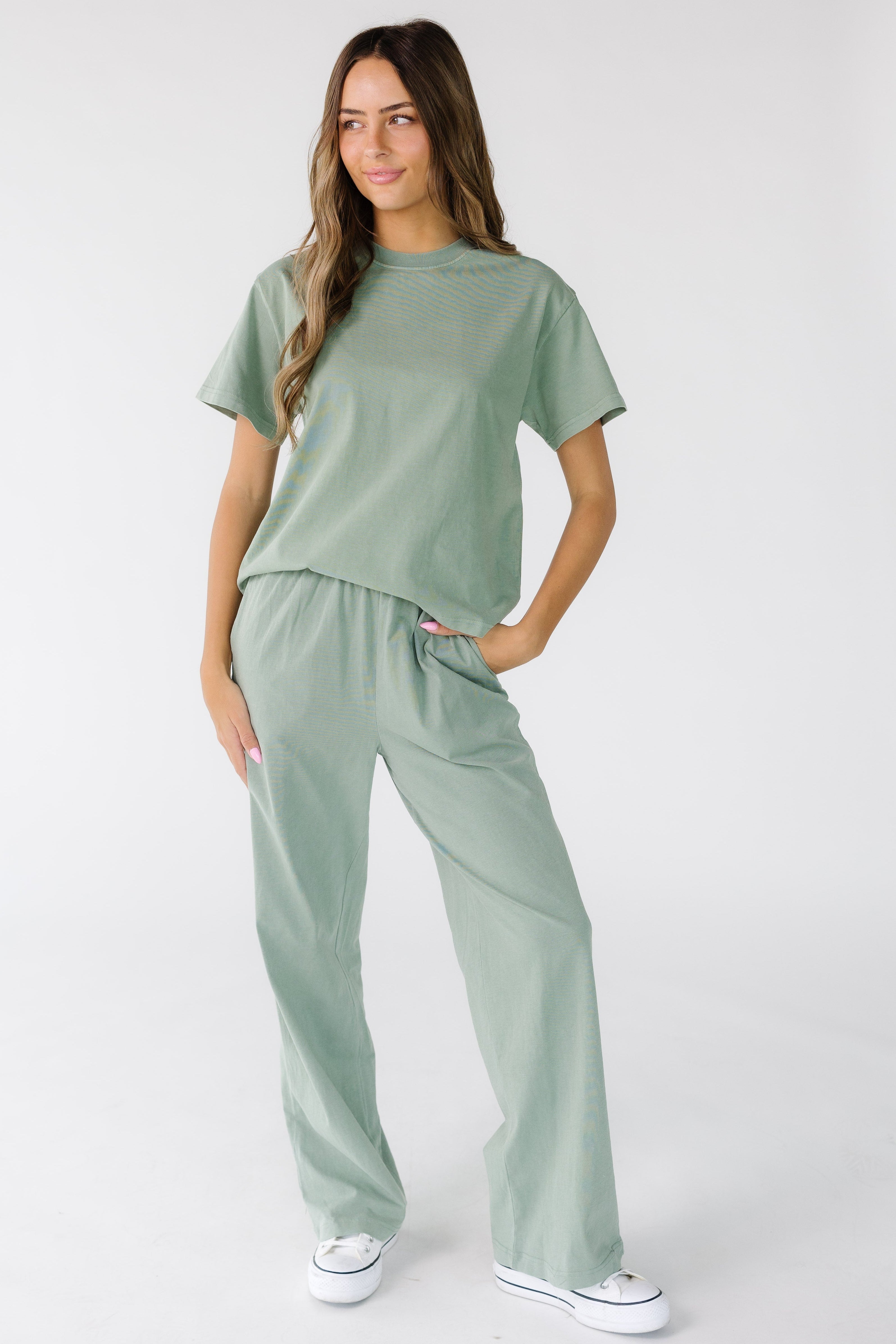 Woman_wearing_a_pair_of_modest_cotton_lounge_pants_in_light_green_side_pockets_and_elastic_waist.jpg Washed Cotton Straight Pants