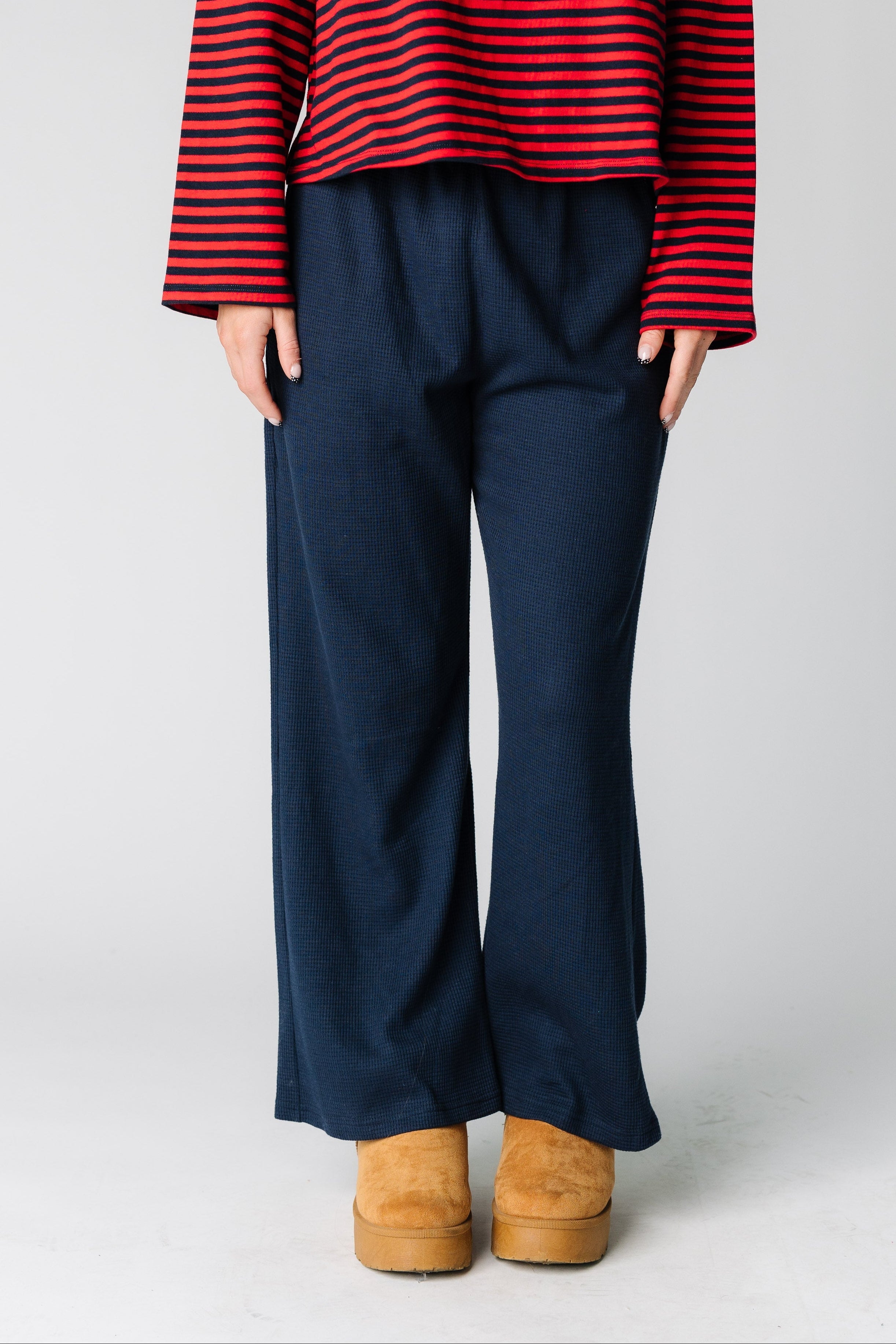 Womanwearingapairofnavywaffletexturedloungepants.jpg Brass & Roe Waffle Lounge Pants Petite