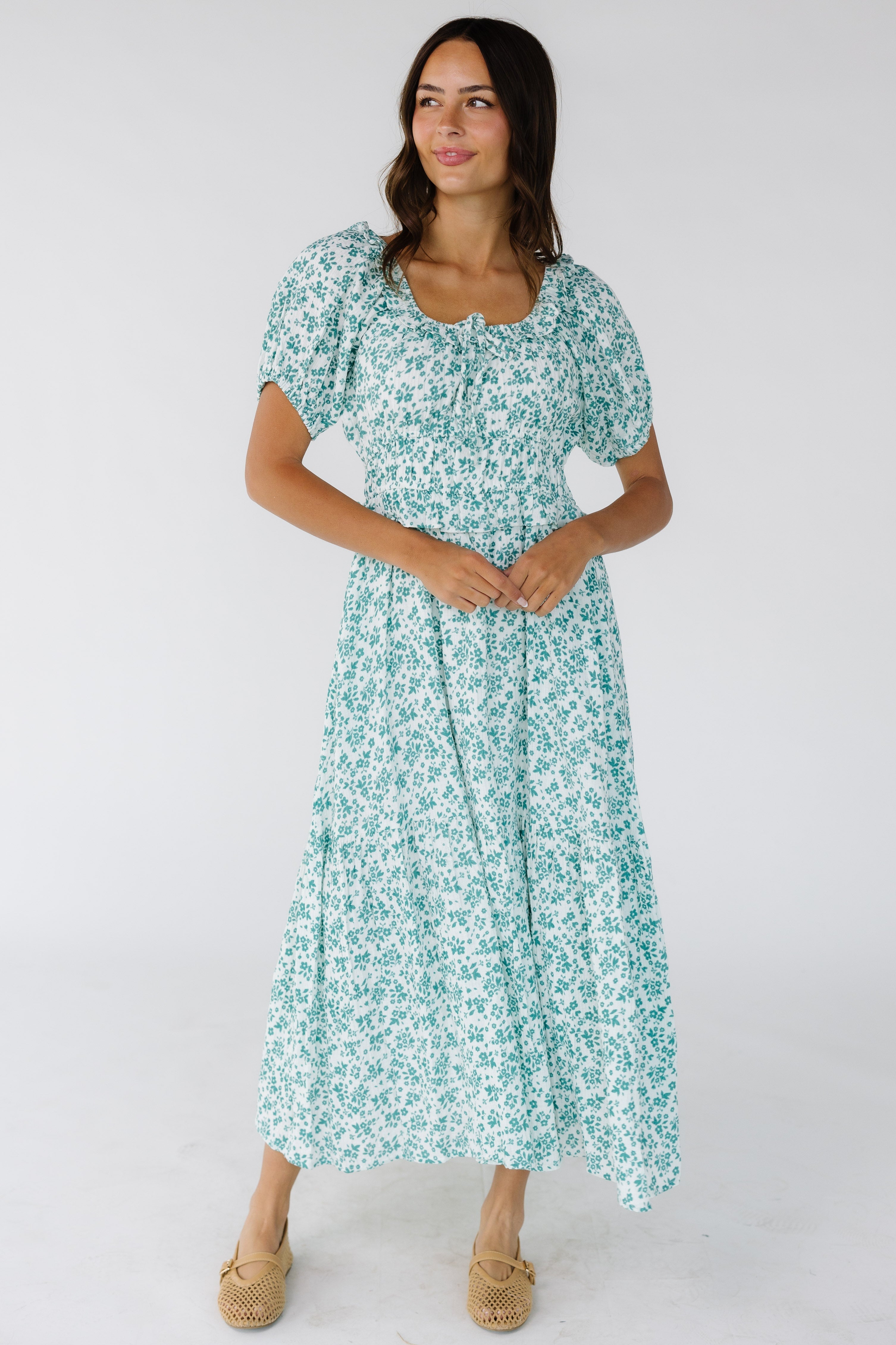 Young_woman_wearing_a_modest_white_and_teal_floral_pint_midi-maxi_dress_with_a_scoop_neckline_and_short_puff_sleeves.jpg Citrus Jena Print Dress
