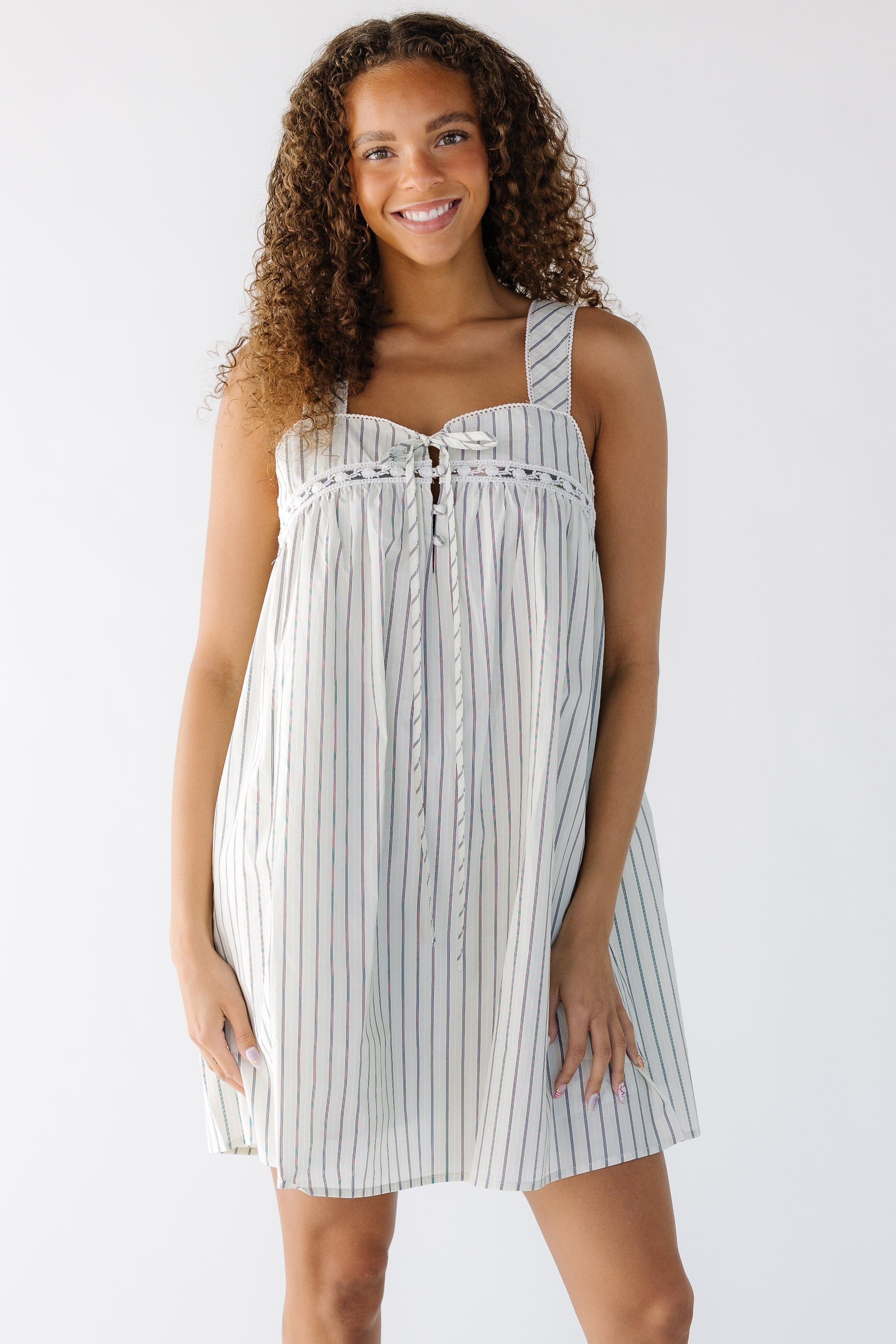 Youngewomanwearinganoffwhiteandblackstripejumperwiththinstraps.jpg The Wren Dress