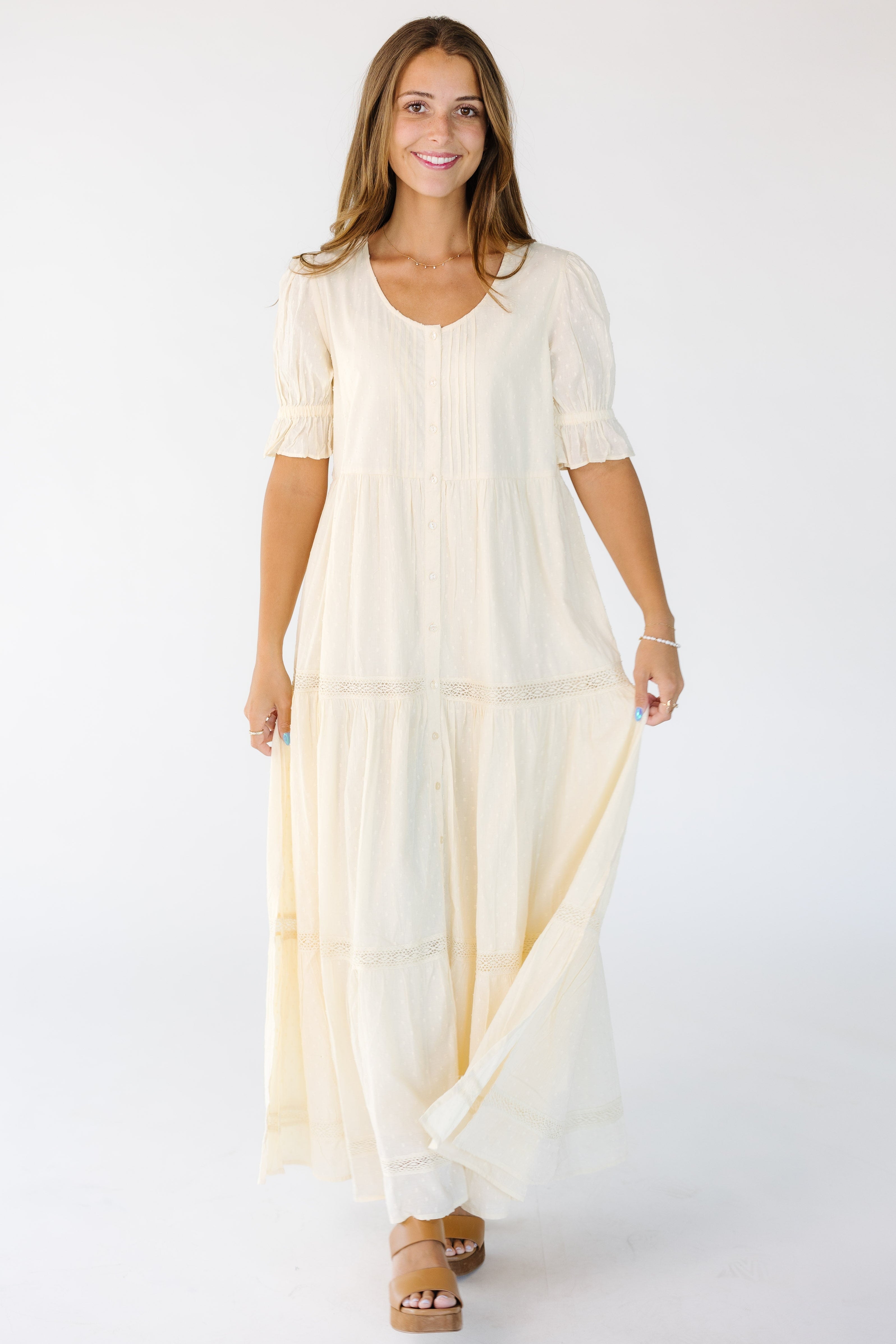 Youngwomanwearingamodestcreammidi-maxidresswithascoopnecklineandshortsleeves.jpg Citrus Cities Cream Dress