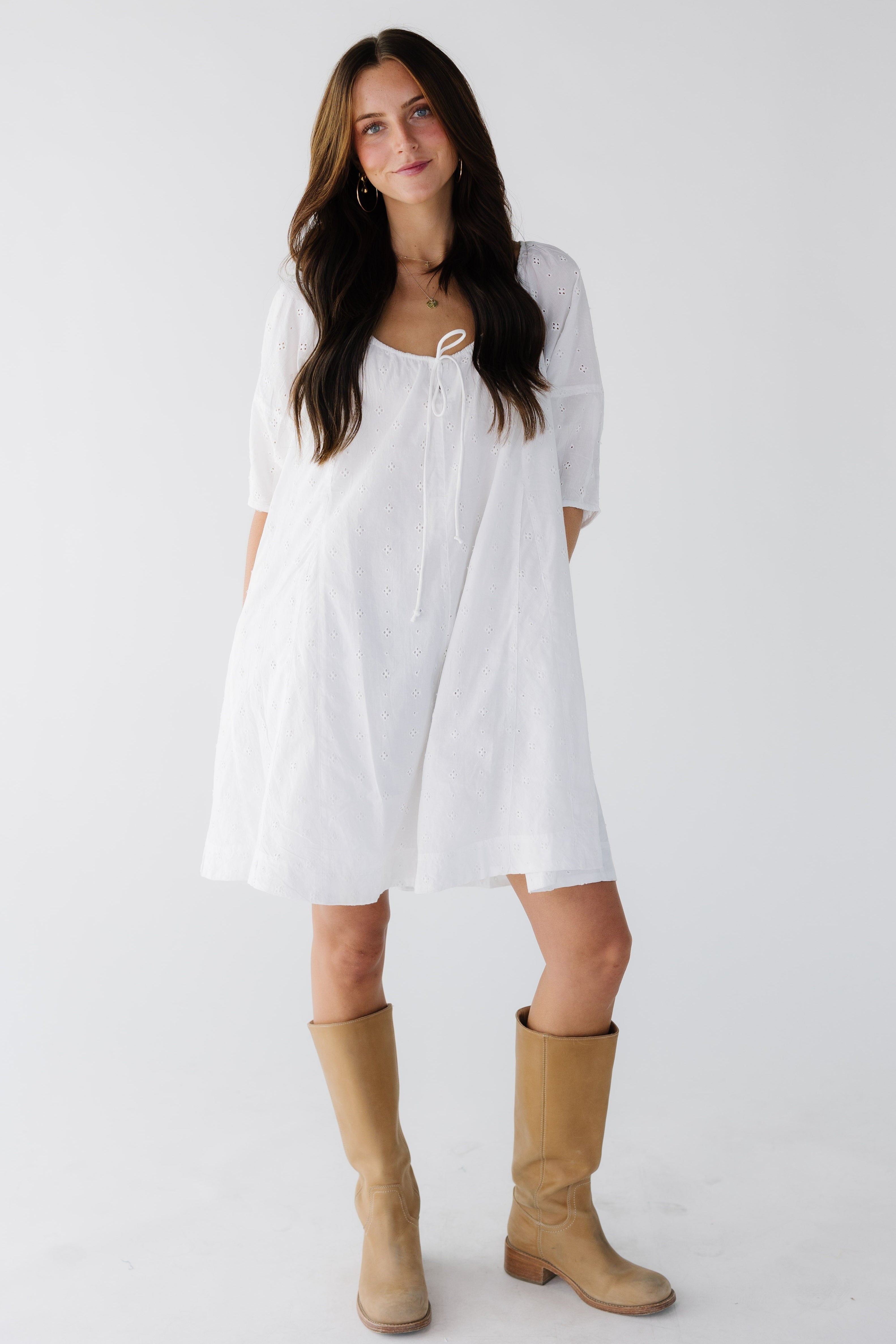 Youngwomanwearingawhiteeyeletshortdresswithawidedrawstringnecklineandfullhalflengthsleeves.jpg Citrus White Shifley Tunic